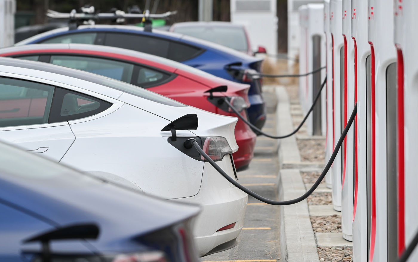 Ev chargers in a parking lot.